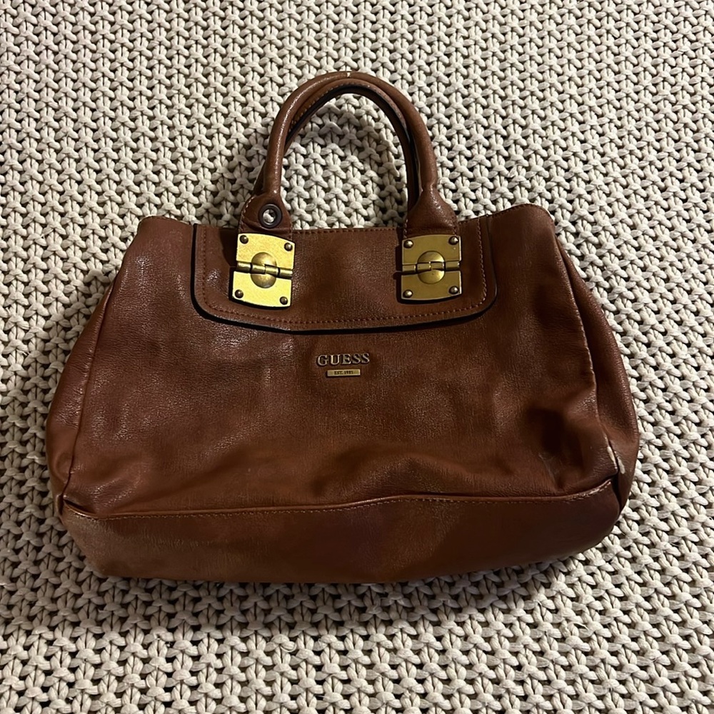 Guess women’s brown leather her purse over the shoulder or under the arm clutch
